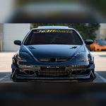 Gold and silver JDM racing windshield banner decal on a tuned coupe