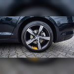 Yellow reflective wheel rim stripe sticker on a car wheel