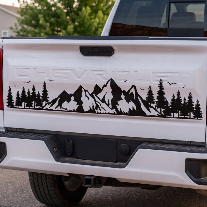 Mountain forest vinyl decal on a truck tailgate